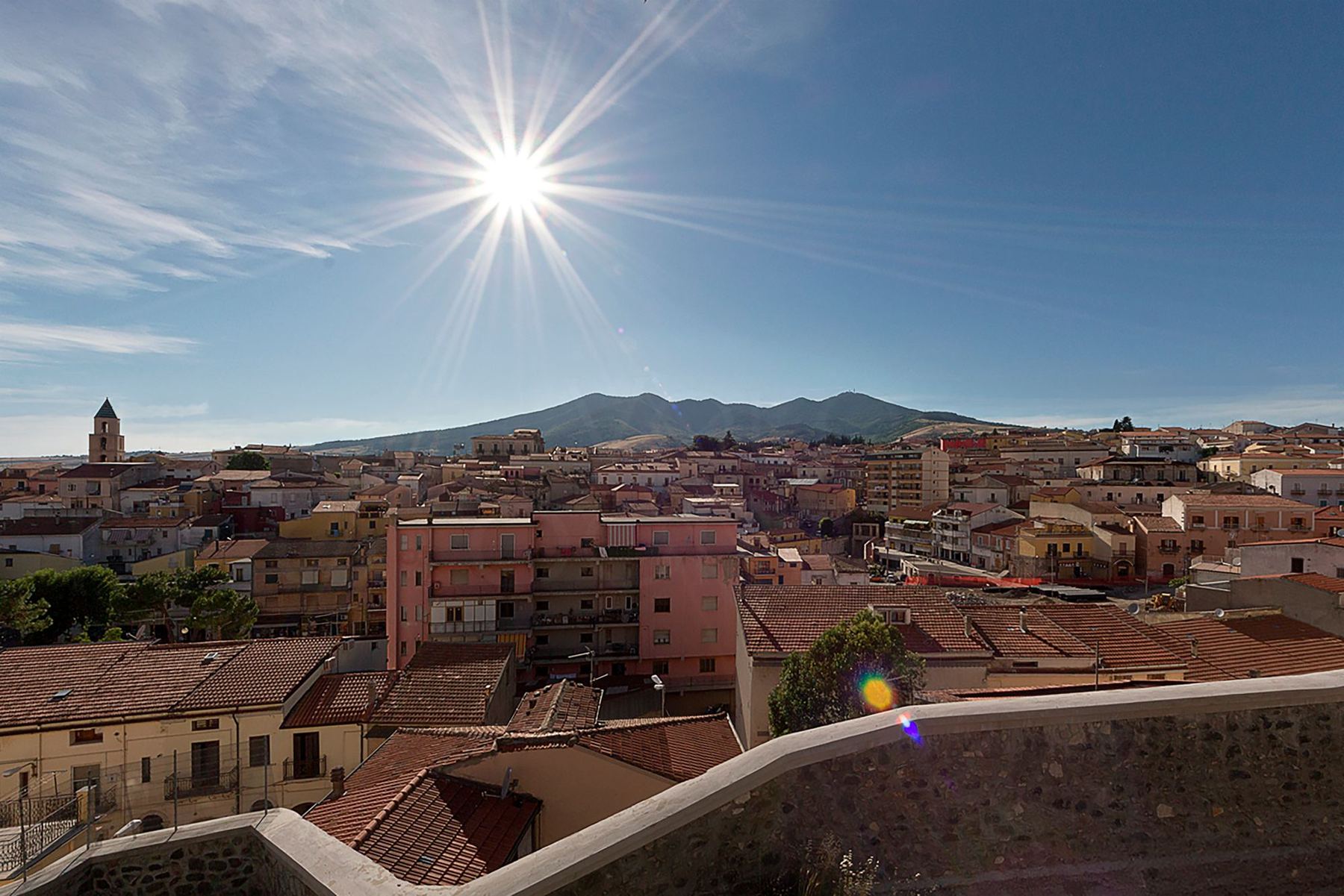 The rooftops, under a full sun